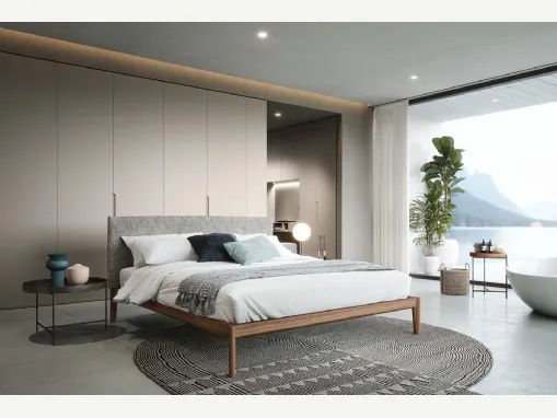 Letto Neos in noce canaletto con testiera rivestita in tessuto di Novamobili