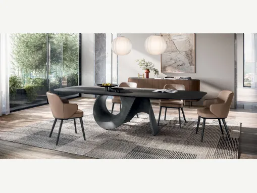 Tavolo di design con piano in ceramica effetto marmo e basamento in cemento Seashell di Calligaris